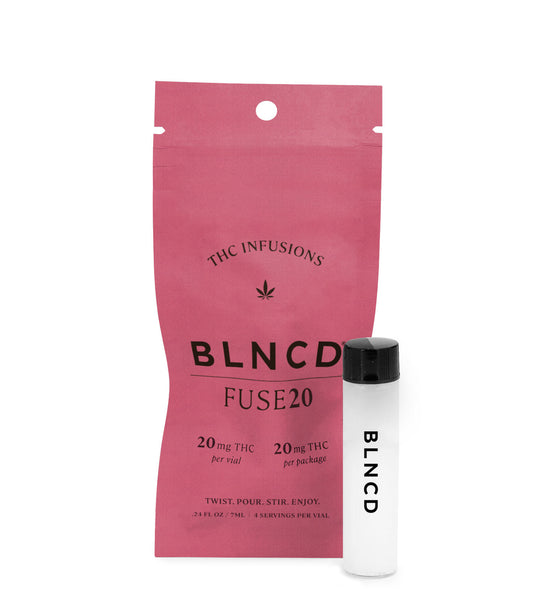 Pink packaging of THC infusions with a white vape pen on a white background