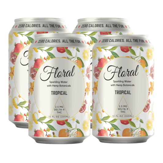 Four cans of 'Floral Tropical' drink on a white background