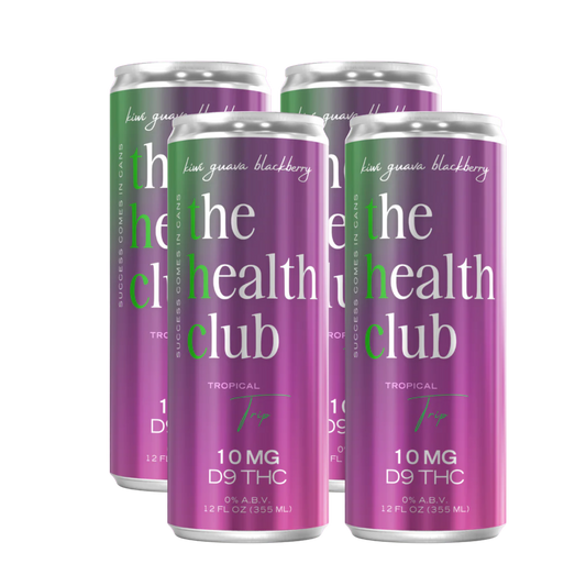 Four cans of 'the health club' tropical tea with visible branding on a white background